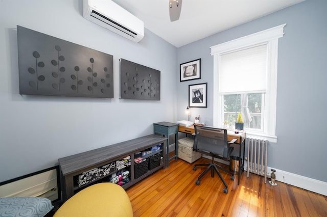 34 Romaine Ave Unit 2, Jersey City, NJ 07306 - home office with a wall mounted AC, radiator heating unit, hardwood / wood-style flooring, and a ceiling fan