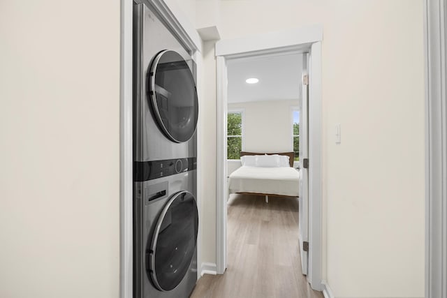 366 7th St Unit 2, Jersey City, NJ 07302 - washroom featuring estacked washer and dryer and light wood-style floors