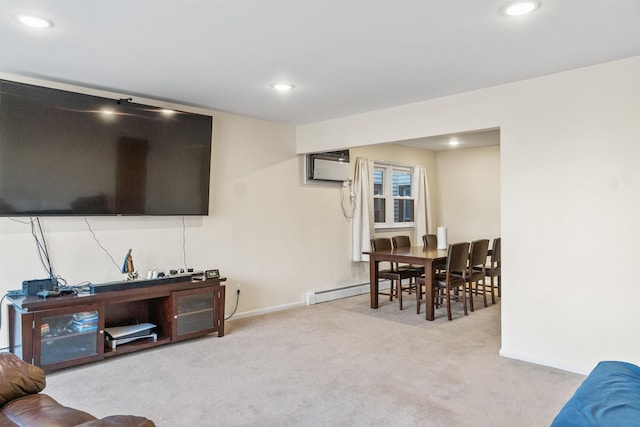 carpeted living area with recessed lighting, a baseboard heating unit, a wall mounted AC, and baseboards