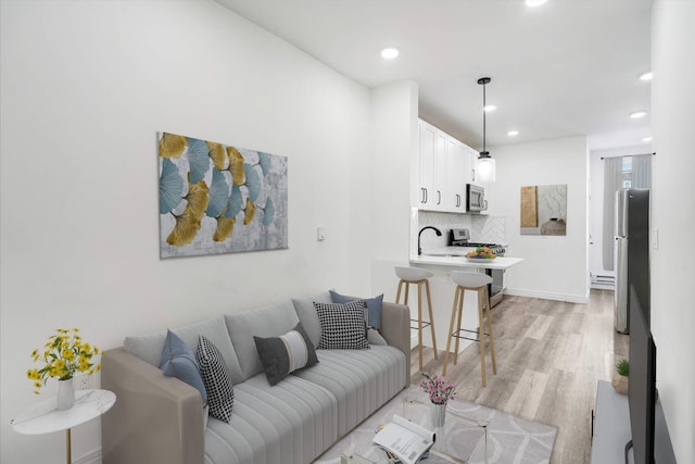 609 New York Ave Unit 2L, Union City, NJ 07087 - living room with light wood-style flooring and recessed lighting