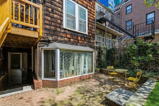 view of side of property with a patio