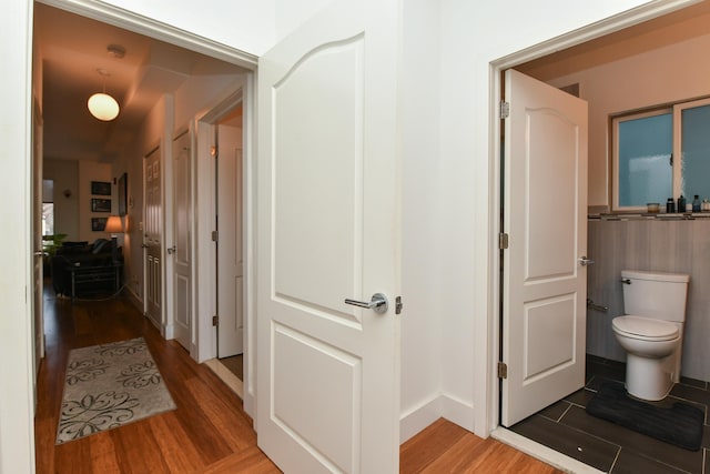 hallway with wood finished floors