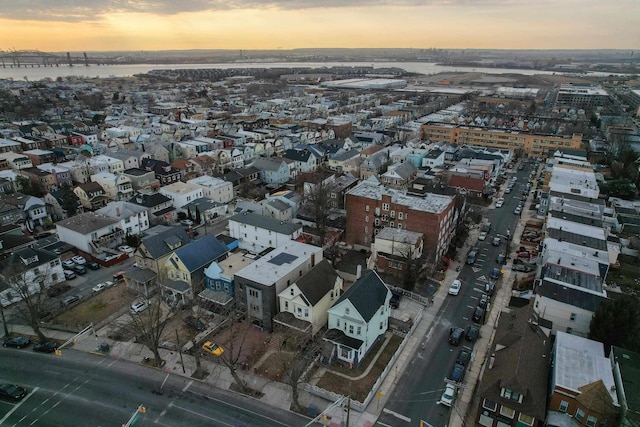 aerial view at dusk with a water view