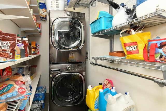 washroom with laundry area and stacked washing maching and dryer