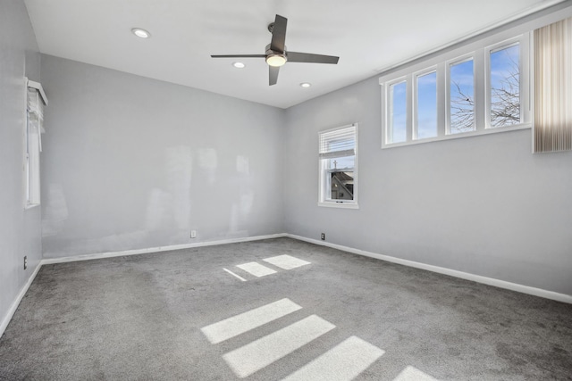 carpeted spare room featuring recessed lighting, ceiling fan, and baseboards