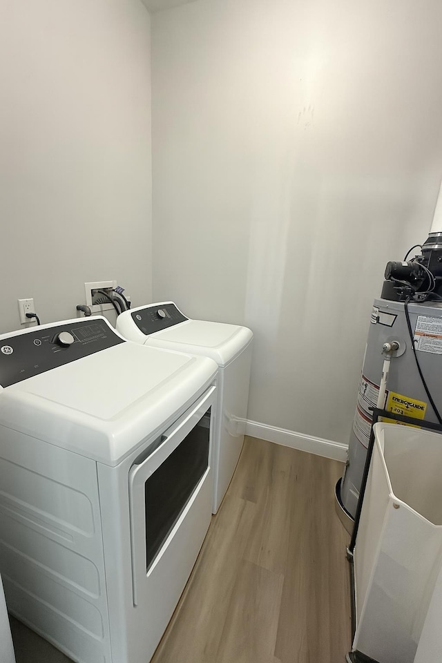 512 Monastery Pl, Union City, NJ 07087 - laundry room with washing machine and clothes dryer and light wood-style floors