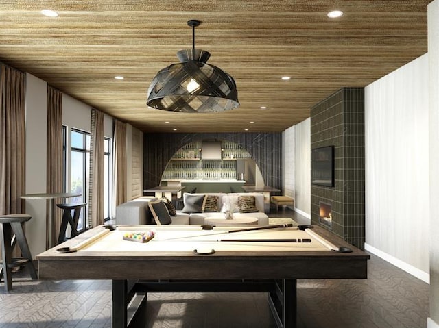 rec room featuring wood ceiling, pool table, and a fireplace