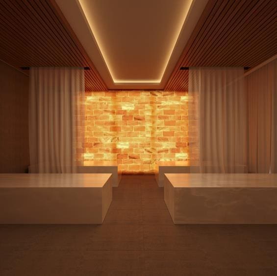 view of sauna featuring brick wall