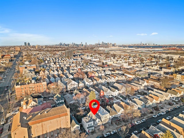 birds eye view of property featuring a city view