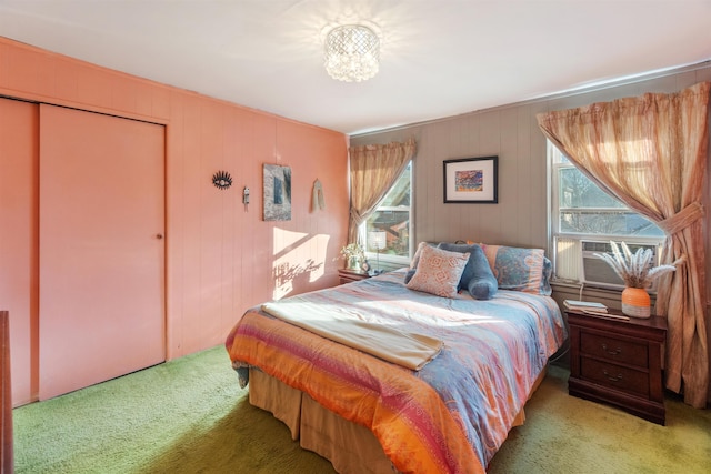 bedroom featuring a closet, carpet flooring, and cooling unit