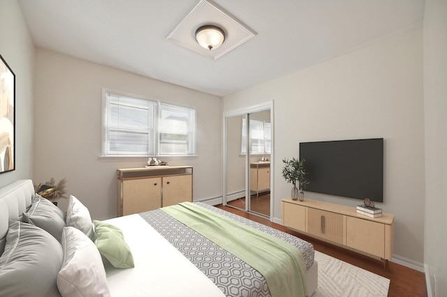 2105 Palisade Ave, Union City, NJ 07087 - bedroom with dark wood-type flooring, a baseboard heating unit, and baseboards