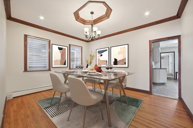 2105 Palisade Ave, Union City, NJ 07087 - dining space with a baseboard radiator, light wood finished floors, a chandelier, baseboards, and crown molding