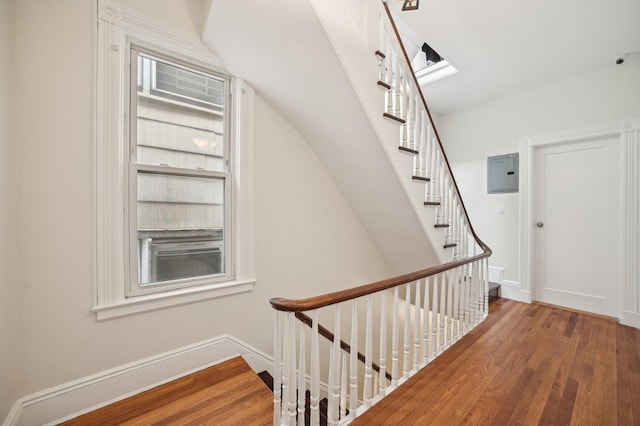 2105 Palisade Ave, Union City, NJ 07087 - staircase with electric panel, wood finished floors, and baseboards