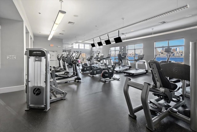 workout area with visible vents and baseboards