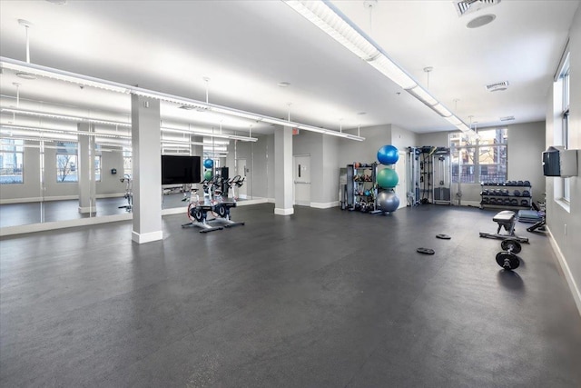 workout area with visible vents and baseboards