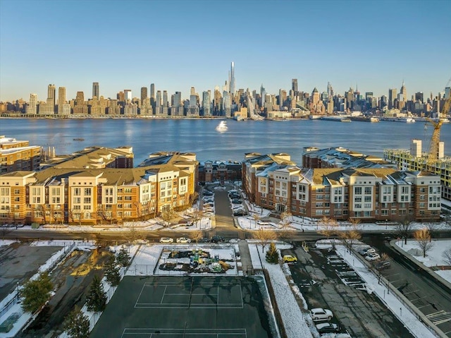 aerial view featuring a water view and a city view