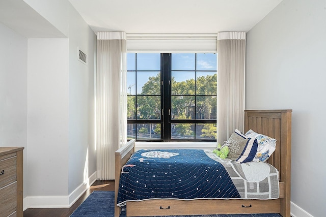 1025 Maxwell Ln Unit 304, Hoboken, NJ 07030 - bedroom with baseboards, visible vents, and wood finished floors