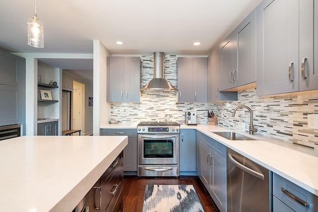 1025 Maxwell Ln Unit 304, Hoboken, NJ 07030 - kitchen featuring appliances with stainless steel finishes, a sink, light countertops, gray cabinets, and wall chimney exhaust hood