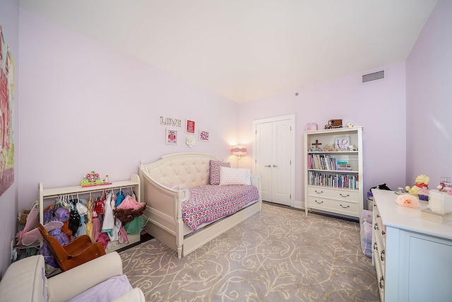 1025 Maxwell Ln Unit 304, Hoboken, NJ 07030 - bedroom featuring visible vents, baseboards, light carpet, and a closet
