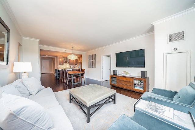 1025 Maxwell Ln Unit 304, Hoboken, NJ 07030 - living room with visible vents, crown molding, wood finished floors, baseboards, and a notable chandelier