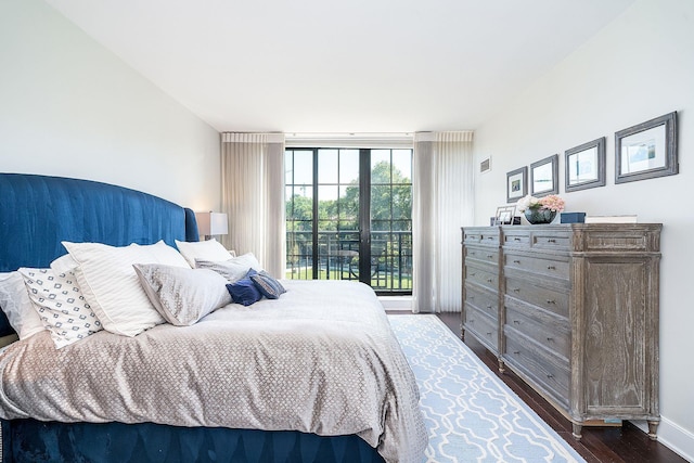 1025 Maxwell Ln Unit 304, Hoboken, NJ 07030 - bedroom with a wall of windows, visible vents, dark wood-style floors, and access to exterior