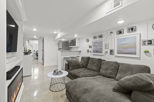 living room featuring a fireplace