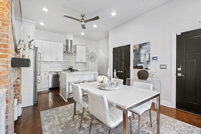 dining space featuring dark wood-type flooring and ceiling fan