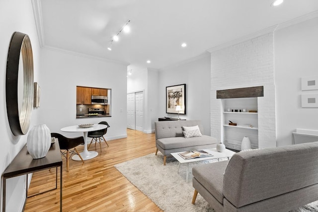 264 9th St Unit 2R, Jersey City, NJ 07302 - living area featuring light wood-type flooring, crown molding, recessed lighting, track lighting, and baseboards