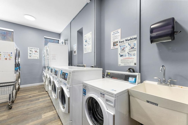 264 9th St Unit 2R, Jersey City, NJ 07302 - shared laundry room with washer and dryer, wood finished floors, stacked washer / dryer, and baseboards