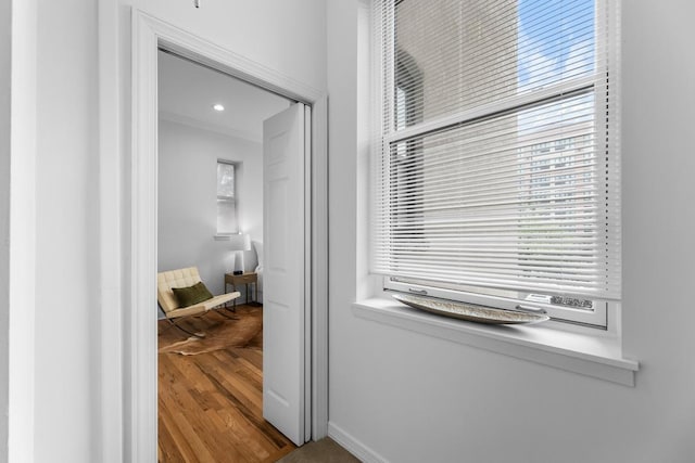 264 9th St Unit 2R, Jersey City, NJ 07302 - hallway featuring baseboards, wood finished floors, and ornamental molding