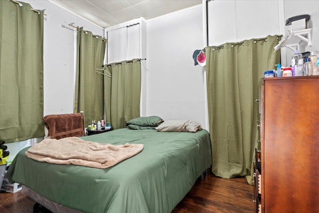 bedroom featuring dark wood-type flooring