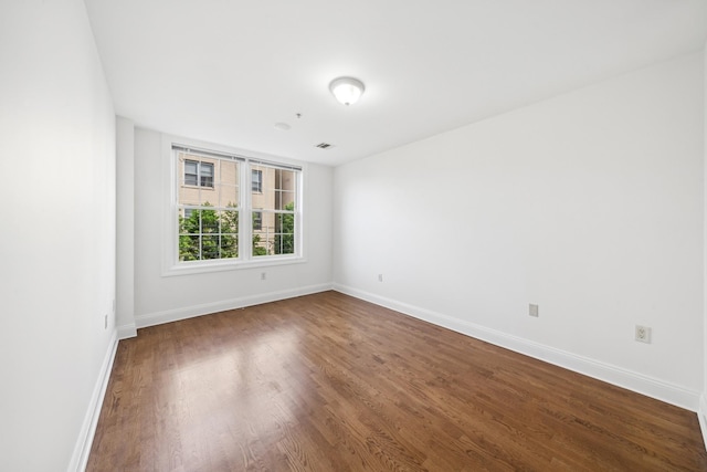 45 Broadway Unit 204, Jersey City, NJ 07306 - spare room featuring baseboards and wood finished floors