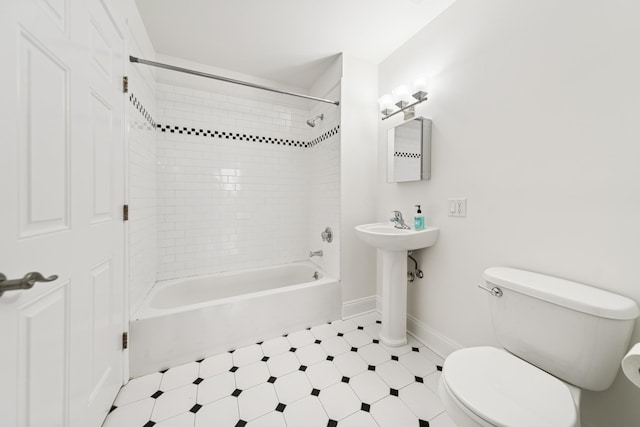 45 Broadway Unit 204, Jersey City, NJ 07306 - bathroom featuring toilet, tile patterned floors, baseboards, and shower / tub combination