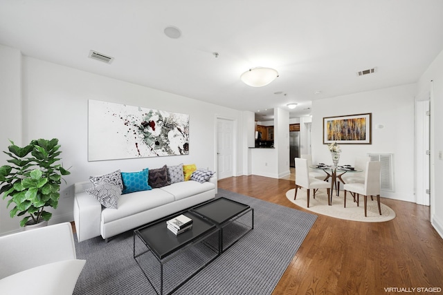 45 Broadway Unit 204, Jersey City, NJ 07306 - living area featuring wood finished floors and baseboards
