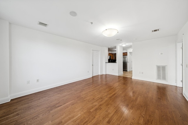 45 Broadway Unit 204, Jersey City, NJ 07306 - unfurnished living room featuring wood finished floors and baseboards