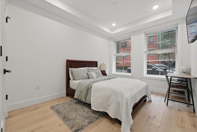 226 Bay St Unit 1, Jersey City, NJ 07302 - bedroom with light wood finished floors, baseboards, a tray ceiling, and recessed lighting