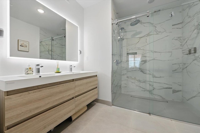 226 Bay St Unit 1, Jersey City, NJ 07302 - full bathroom with double vanity, a marble finish shower, tile patterned floors, and recessed lighting