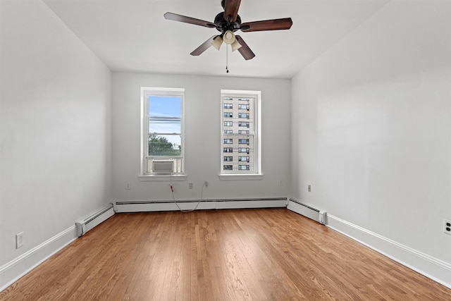422 Grand St Unit 4, Hoboken, NJ 07030 - empty room with light wood-type flooring, a ceiling fan, baseboards, and cooling unit
