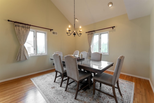 12 Davey Dr, West Orange, NJ 07052 - dining room featuring a chandelier, wood finished floors, and high vaulted ceiling