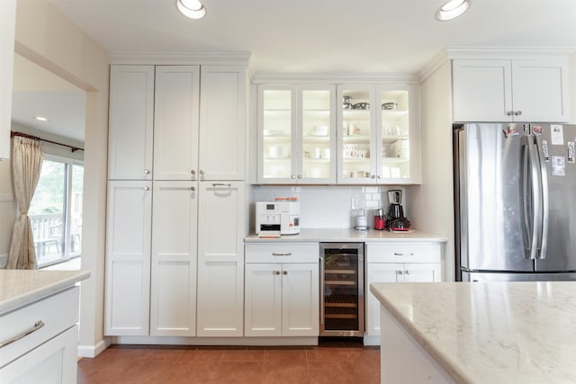 12 Davey Dr, West Orange, NJ 07052 - kitchen with beverage cooler, freestanding refrigerator, decorative backsplash, white cabinetry, and glass insert cabinets