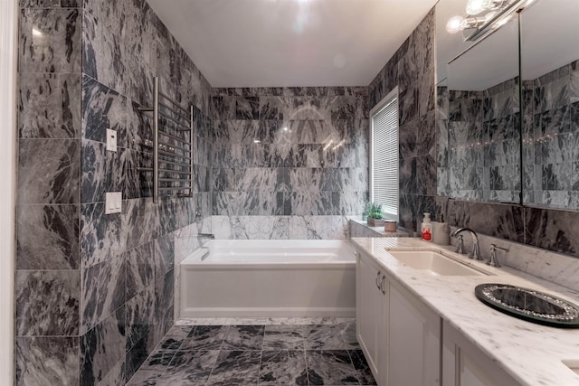 12 Davey Dr, West Orange, NJ 07052 - full bath with a bath, tile walls, double vanity, and marble finish flooring