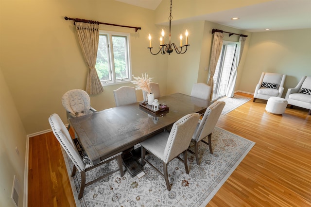 12 Davey Dr, West Orange, NJ 07052 - dining area featuring a chandelier, wood finished floors, and lofted ceiling