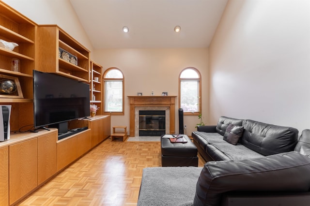 12 Davey Dr, West Orange, NJ 07052 - living area with plenty of natural light, a fireplace with flush hearth, and high vaulted ceiling