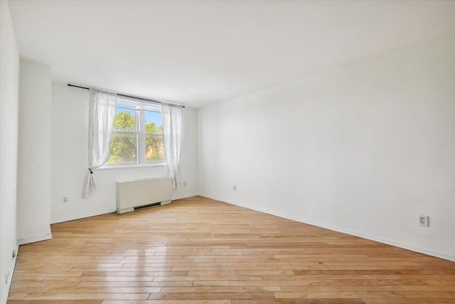 380 Mountain Rd Unit 213, Union City, NJ 07087 - spare room featuring light wood-style floors and radiator