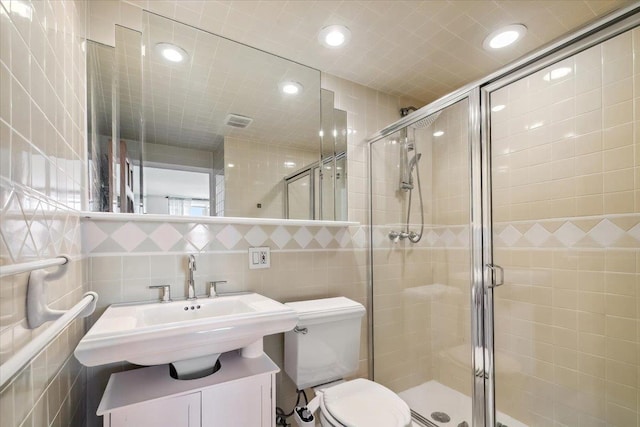 380 Mountain Rd Unit 213, Union City, NJ 07087 - full bathroom with a stall shower, recessed lighting, tile walls, and vanity