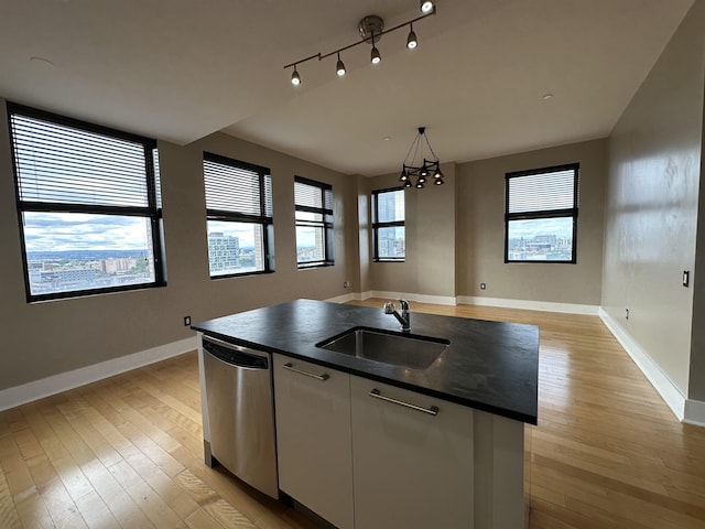 4 Beacon Way Unit 1001, Jersey City, NJ 07304 - kitchen featuring dishwasher, a sink, dark countertops, and light wood-style flooring