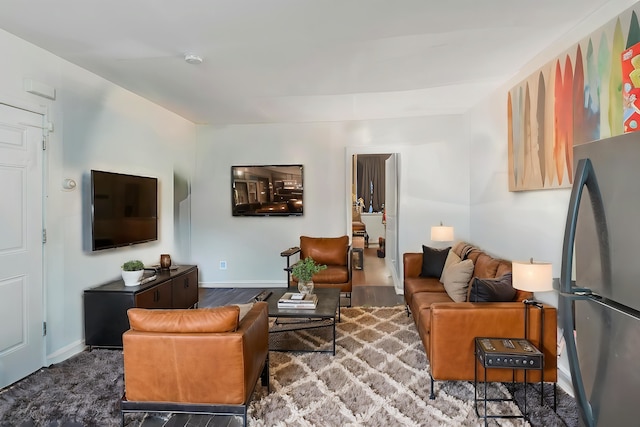 living room with dark hardwood / wood-style flooring