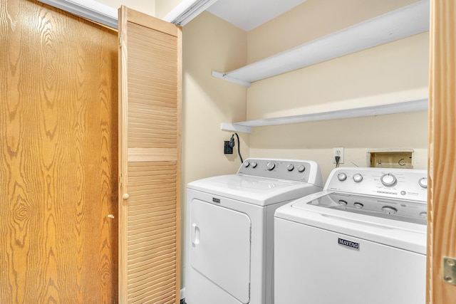 clothes washing area with laundry area and washing machine and clothes dryer