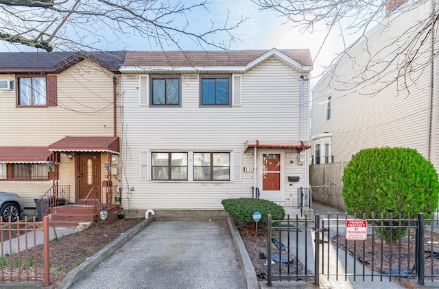 view of property featuring a gate and a fenced front yard