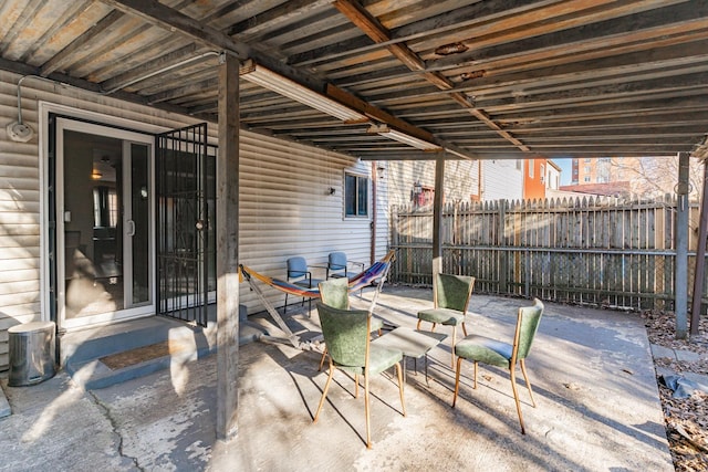 view of patio / terrace featuring fence